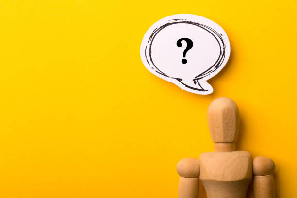 istock Wooden Man With Question Mark Speech Bubble 1257739463