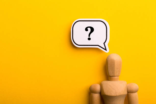 istock Wooden Man With Question Mark Speech Bubble 1257739467