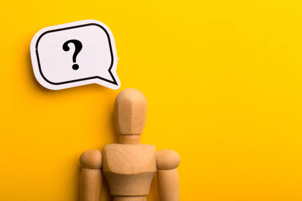 istock Wooden Man With Question Mark Speech Bubble 1257739470