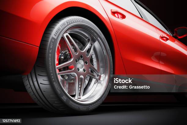 Wheel Of Red Sports Car Closeup In Studio Lighting Stock Photo - Download Image Now - Car, Tire - Vehicle Part, Close-up