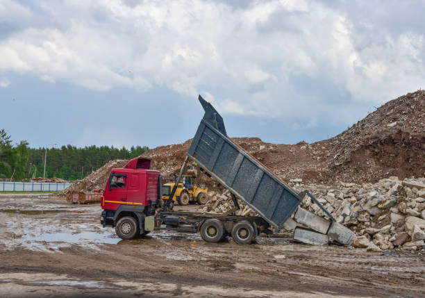 forklift - warehouse production in quarry blue clay on sky background