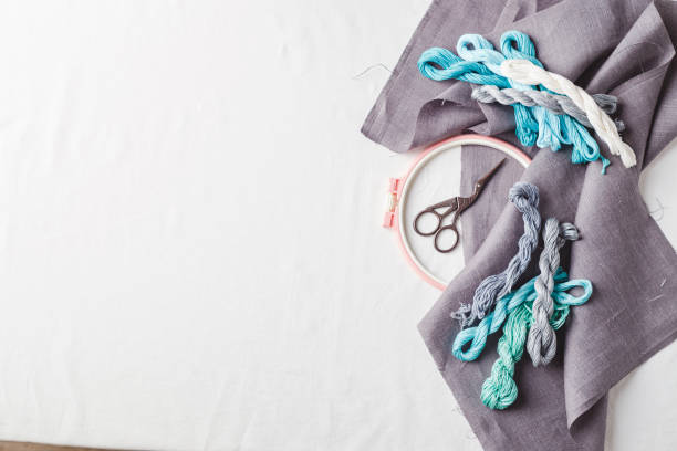 istock Embroidery set. Linen fabric, embroidery patterns, embroidery hoop, colorful threads and needls. 1257743441