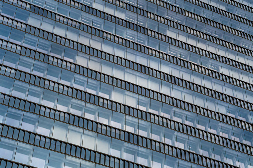 Glass Facade Of Modern Office Buildings With Reflections Of Neighboring Towers In The City Of Vienna