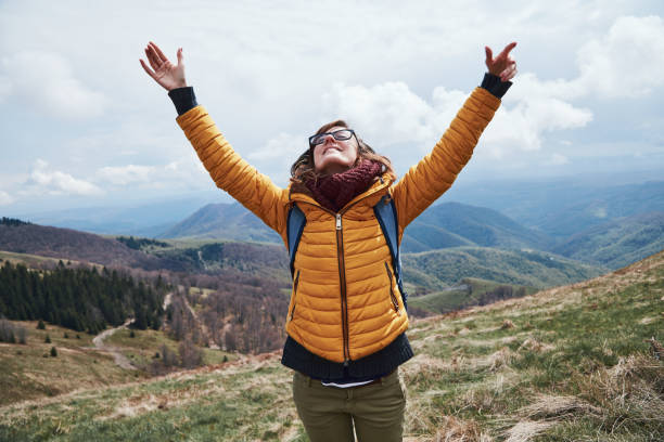 istock Woman enjoying on a mountain fresh air. 1257749655