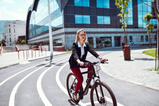 istock Elegant Female Riding A Bicycle After Work To Home 1257750462