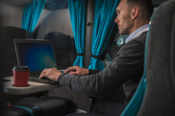 istock Businessman Working on His Laptop Computer During Coach Bus Road Trip 1257752207