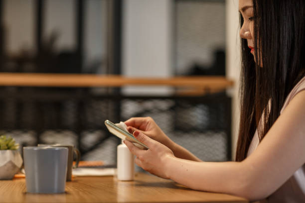 istock Coffee break to disinfect her phone 1257752591
