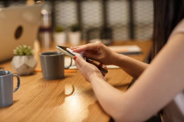 istock Disinfecting smartphone in the office after long meeting 1257752597