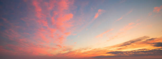 istock Beautiful clouds illuminated by sunrise. Sky background 1257753713