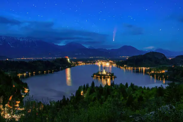 Photo of Comet C 2020 F3 Neowise in night sky over Lake Bled, Slovenia