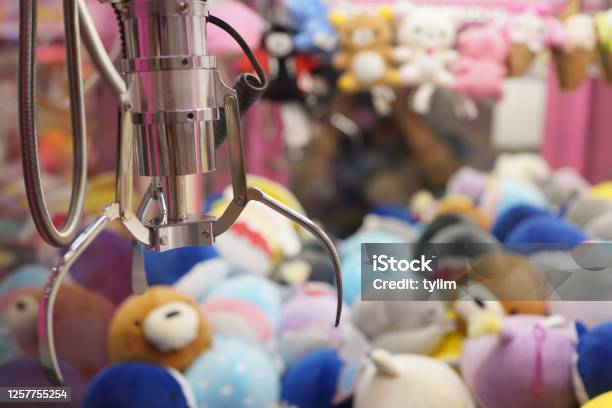 Close Up Of The Doll Claw Machine Of Games Arcade In Shopping Mall Stock Photo - Download Image Now