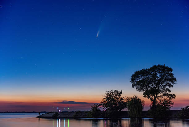 istock Comet C/2020 F3 Neowise in night sky over Dnieper river, Ukraine 1257759727