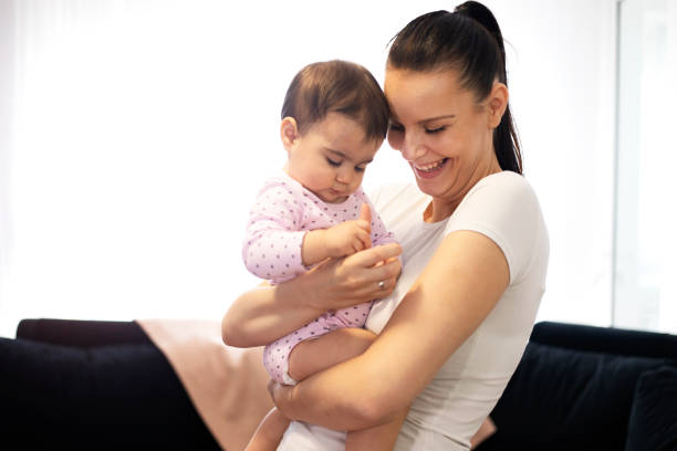 istock Mother holding her cute baby 1257759756