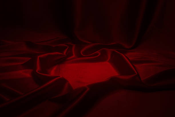 istock Red silk or satin luxury fabric texture can use as abstract background. 1257774866