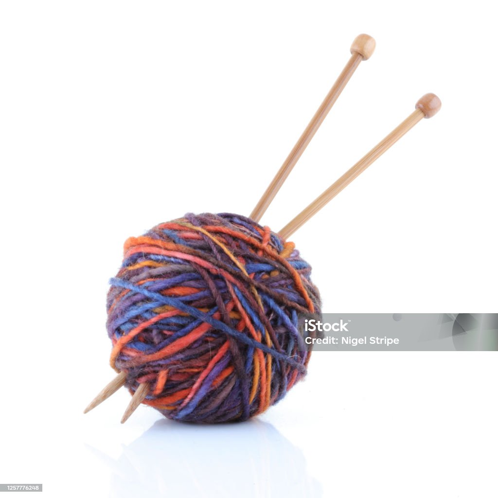 Ball of wool yarn with knitting needles A ball of wool yarn with knitting needles Knitting Needle Stock Photo