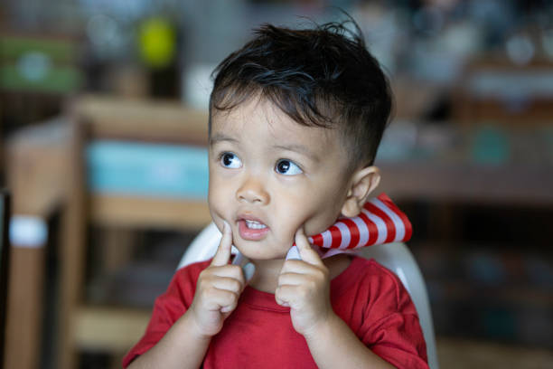 istock Adorable boy holding a Malaysia flag 1257778111