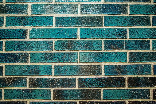 A texture of turquoise colored bricks