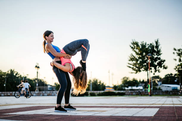 istock Women doing acroyoga 1257779756
