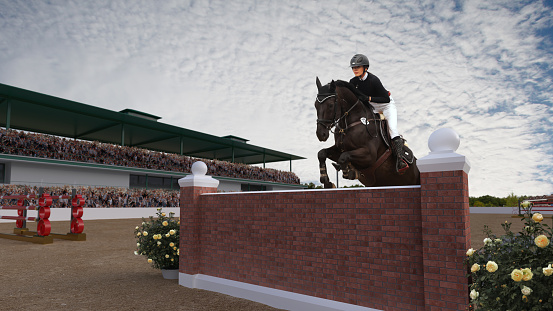 Smartly turned out young female rider hangs on to the neck of her grey horse during a show jumping competition, as the horse refuses to jump the jump and unseats the rider.