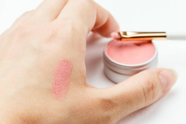 istock Making swatch on a hand of pink lipstick or blush 1257786920