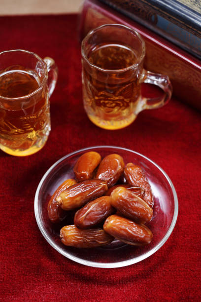 istock Dates fruit on carpet background, Islamic background in mosque 1257789590