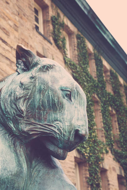 Princeton, New Jersey - April 14, 2017: Details of the bronze tiger at the front of Nassau Hall on Princeton University