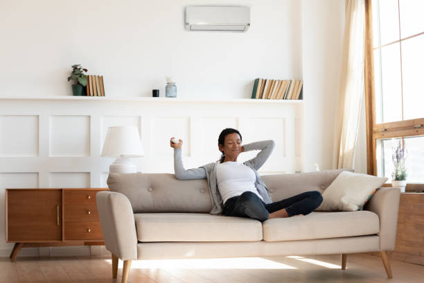 istock African american girl sit on comfortable sofa 1257791032