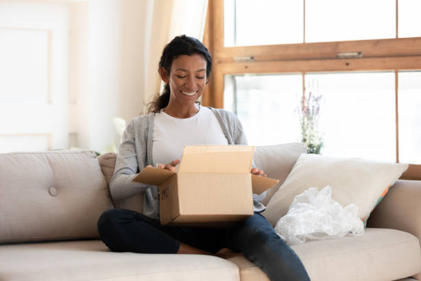 istock African american girl unpack parcel cardboard box 1257791047