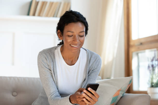 istock Black girl hold smartphone and look at screen 1257791050