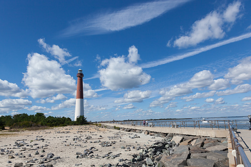Barnegat Light, New Jersey - September 29, 2017: People walk and fish on a beautiful day on the Barnegat Bay