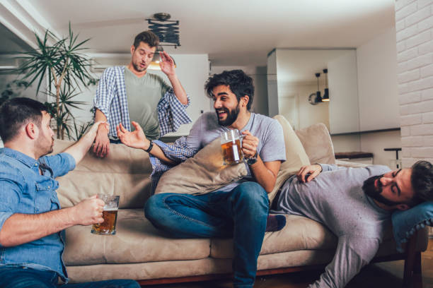 istock Drunk guys are sleeping after night events on the floor and sofa 1257792817