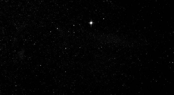 istock Shining star in the starry sky 1257794132