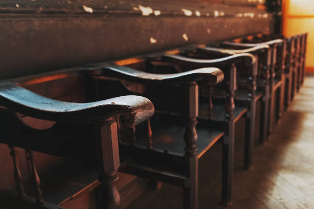 istock Rows of Church benches with sunlight close-up. 1257795811