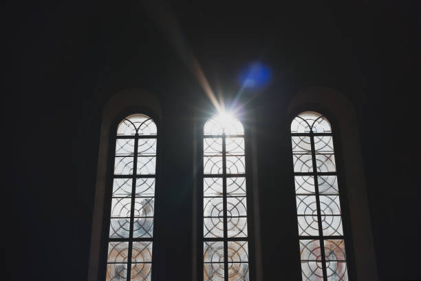 istock Vertical high Windows of the temple with sunlight. Three 1257795979