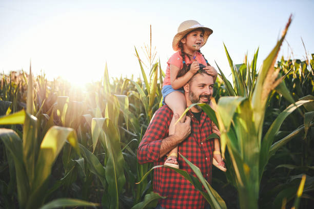 Farmer introducing his curious daughter with a agricultural activities