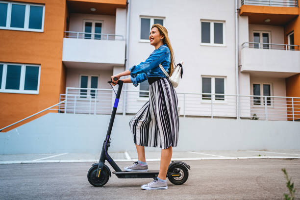 istock Young woman on electric scooter 1257798365