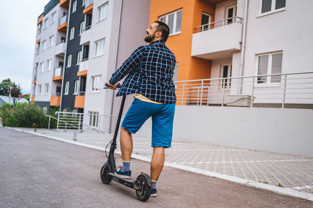 istock Male commuter with electric push scooter 1257799644