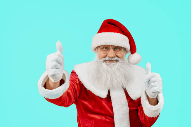 istock Smiling Santa Claus showing thumbs up. 1257799767