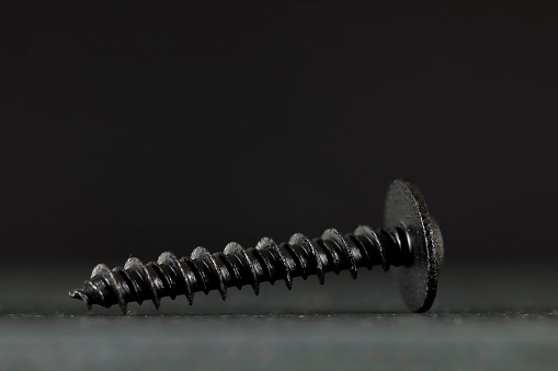 One black screw. This small industrial item is automotive part and have been specially designed to be used for the automotive industry but can be used for other applications if necessary.