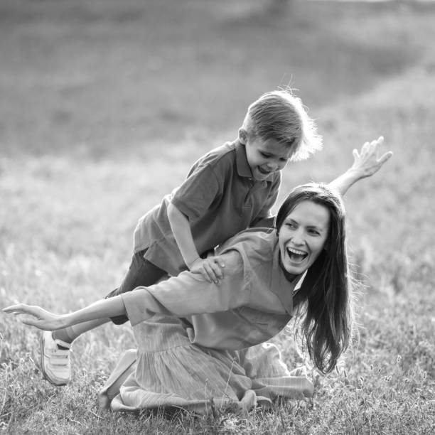 istock happy mother and son playing 1257805681
