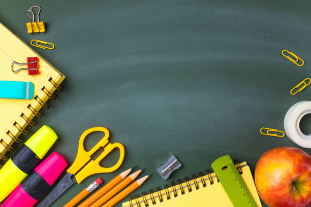 istock School supplies on blackboard. Back to school concept. 1257808595
