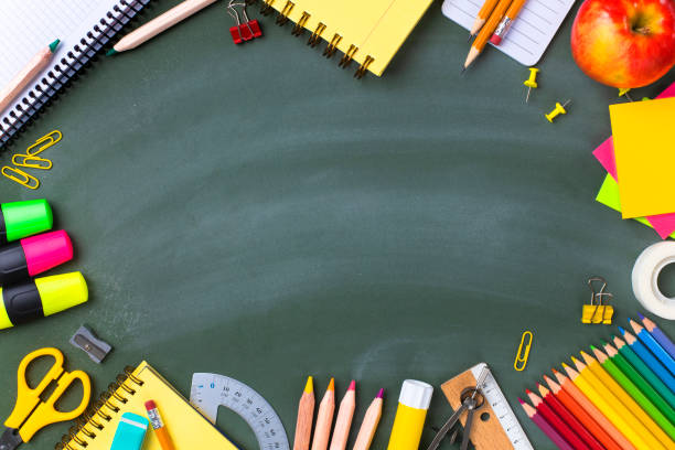 istock School supplies on blackboard. Back to school concept. 1257808705