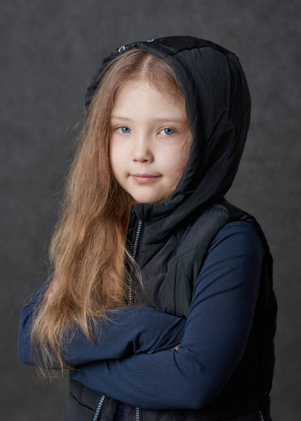 istock Young girl wearing jacket and sweater 1257809484