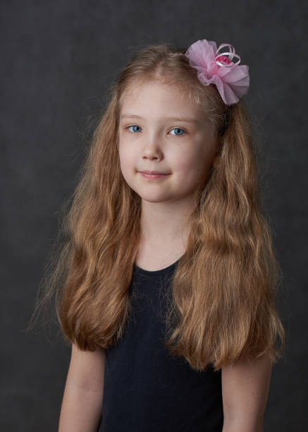 istock Young girl in black top 1257809555