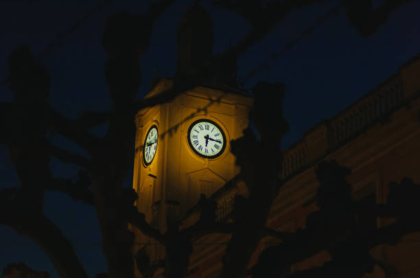 istock Beautiful clock tower at quarter past six. Autumn sunset 1257810652