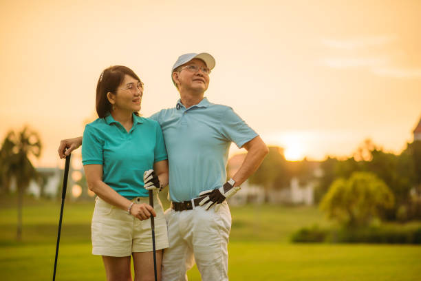 istock Asian chinese active senior smiling couple golfer enjoy a day at golf course 1257810968