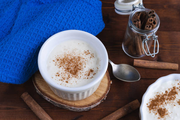 istock Creamy rice pudding and cinnamon on a wooden base. Pastry concept. 1257812331