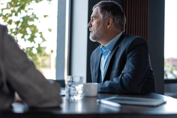 istock Image of mature businessman interviewing female. 1257814763