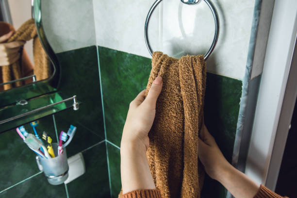 istock woman dry  hands with a towel 1257814799