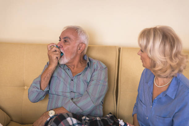 istock Senior Man with Asthma has Breathing Problems so he is Using an Inhaler. 1257814924